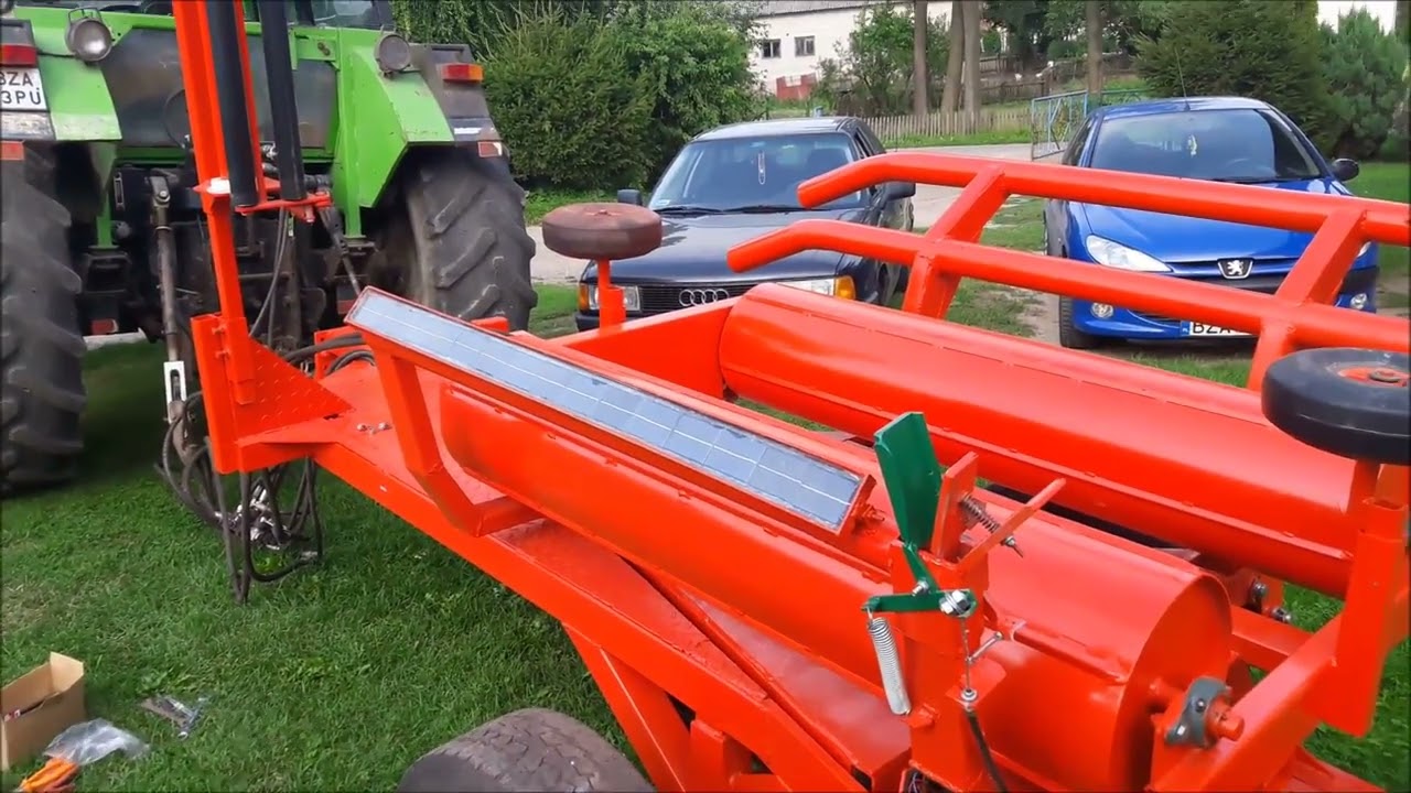 MECHANICZNO ELEKTRONICZNY ŁAPACZ FOLII W OWIJARCE SAMOZAŁADOWCZEJ SAM