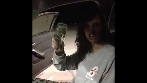 girl littering glass bottle
