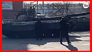 Fearless Ukrainian man kneels in front of marauding Russian convoy in Tiananmen tank moment