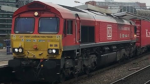 DB Cargo 66136 (YIWU LONDON TRAIN) and Transport For Wales 175003 passing Manchester Piccadilly