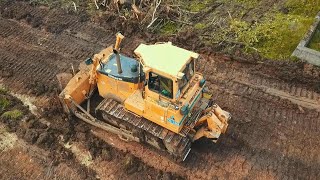 Dressta TD-15M stripping topsoil - Drone video