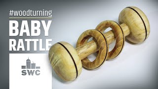 Making a baby rattle with two captive rings out of mulberry wood