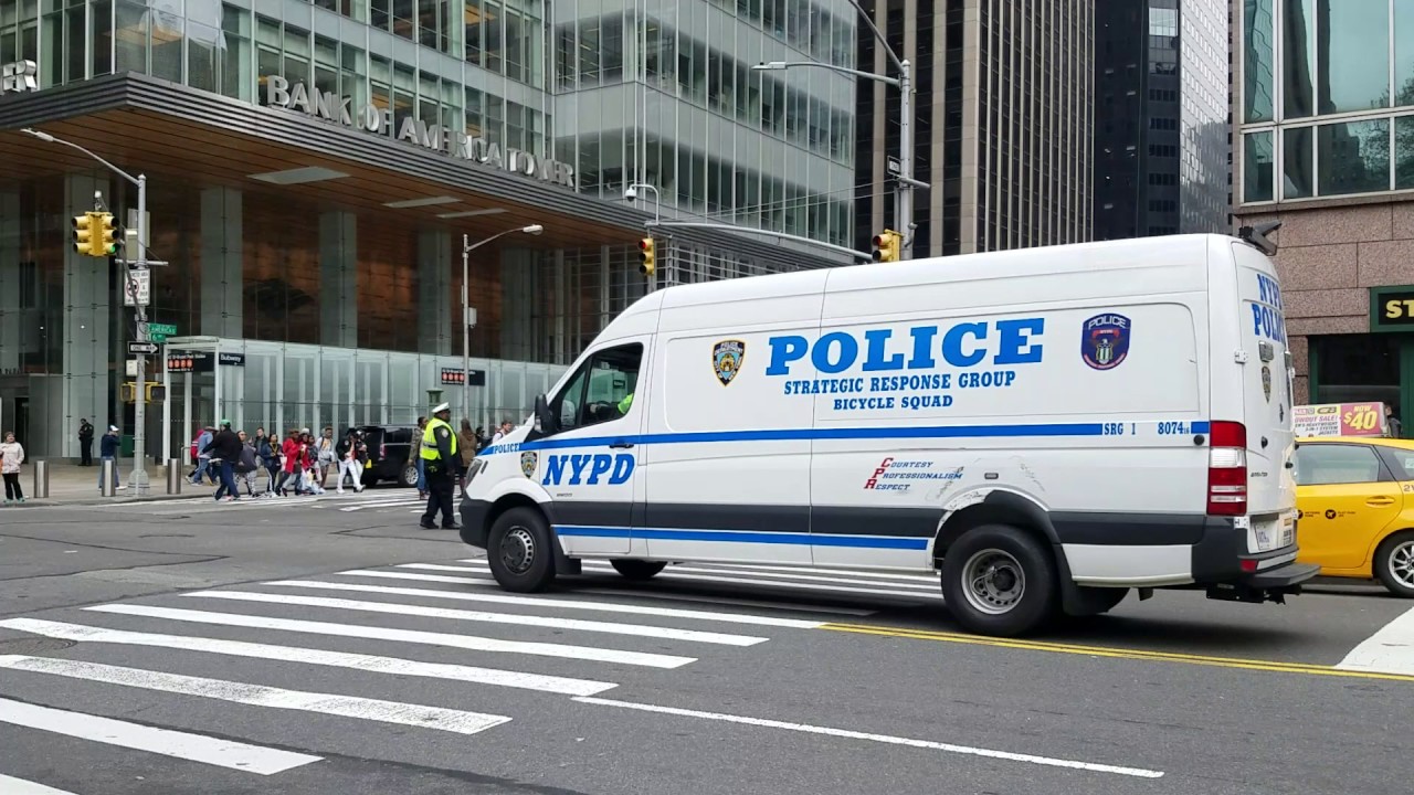 New NYPD Strategic Response Group Bicycle Squad Passing By On East 42nd Street In Manhattan, NYC