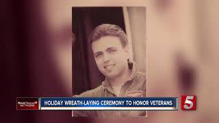 Volunteers lay wreaths on veterans' graves
