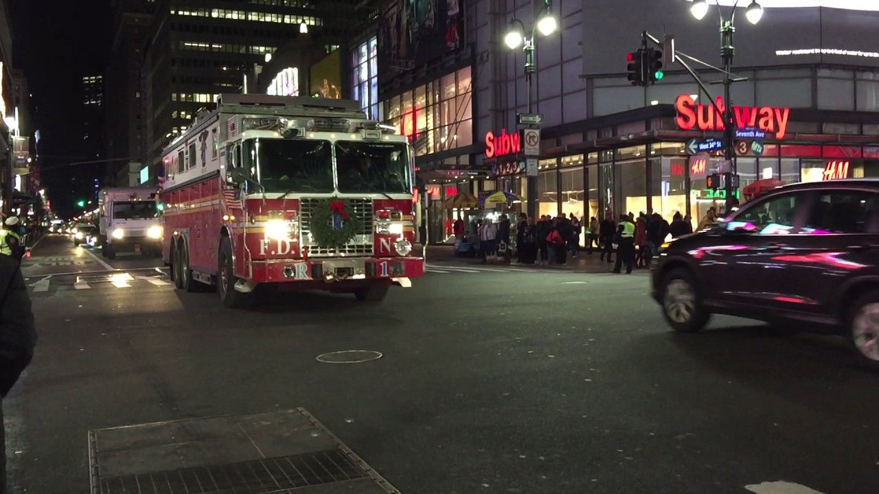 FDNY RESCUE 1 CRUISING BY ON WEST 34TH STREET IN THE MIDTOWN AREA OF MANHATTAN IN NEW YORK CITY.