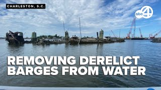 Cleanup effort targets derelict barges in Clouter Creek in Charleston