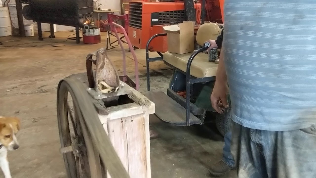 Shelling corn with hit and miss motor