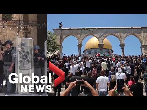 Palestinian protesters clash with Israeli police outside Al-Aqsa mosque in Jerusalem