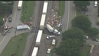 Roadway to be closed for 'hours' after train collides with tractor trailer in Buford