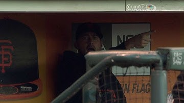 Giants players avoid foul ball in the dugout