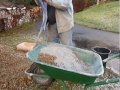 Mixing concrete by hand in a wheelbarrow the easy way