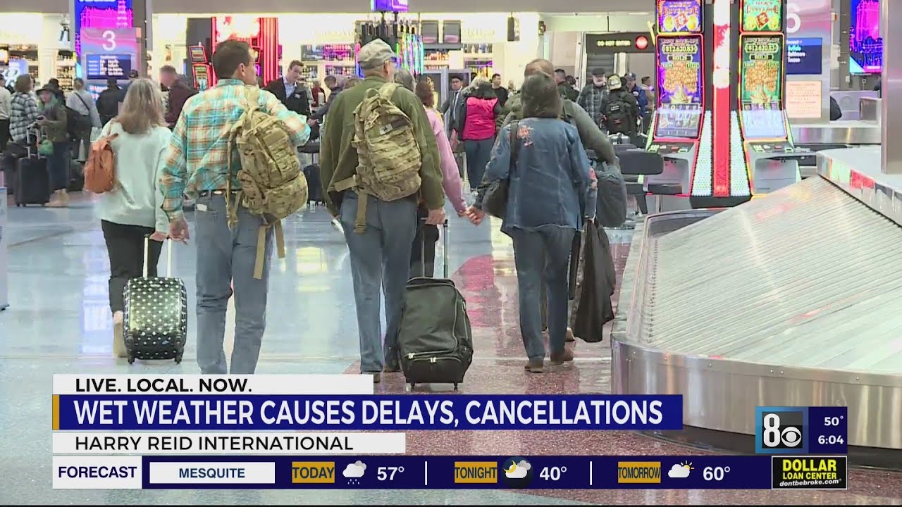 Wet weather causes delays, cancellations at airport - YouTube