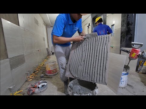 Video quá trình đệ ốp gạch tường 60x60 thang máy... - youtube