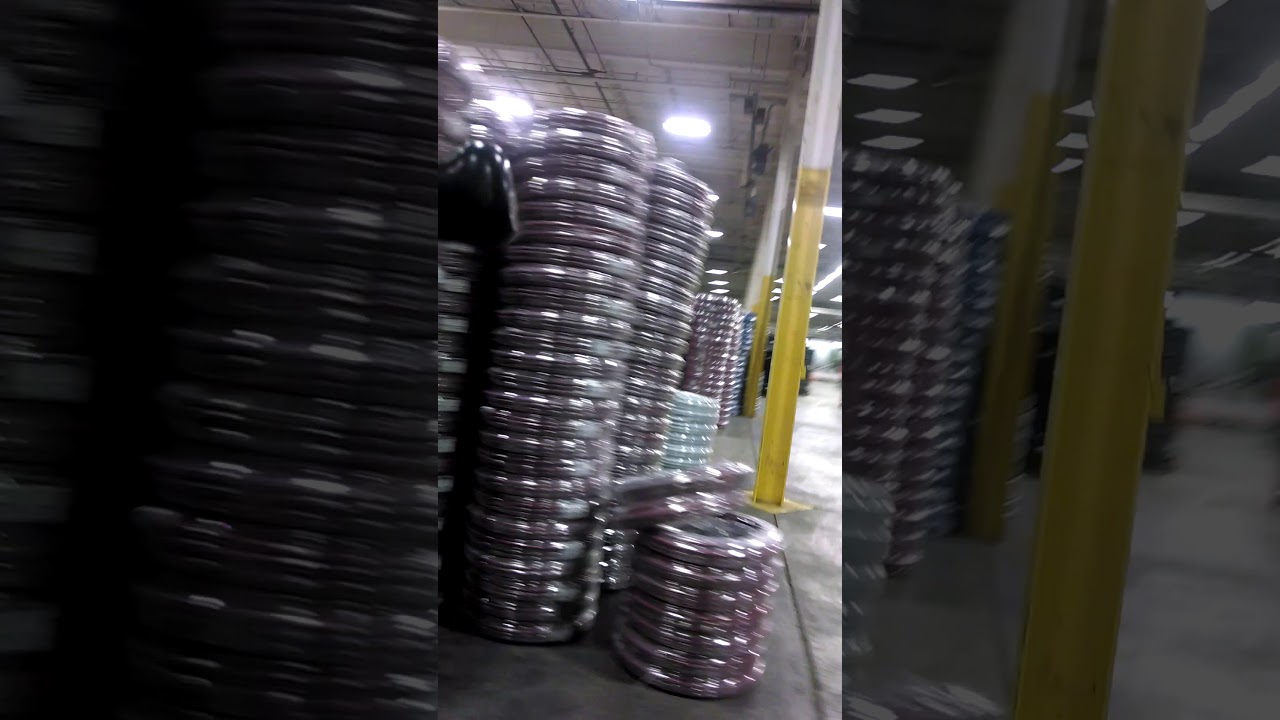 Forklift cup holder cam