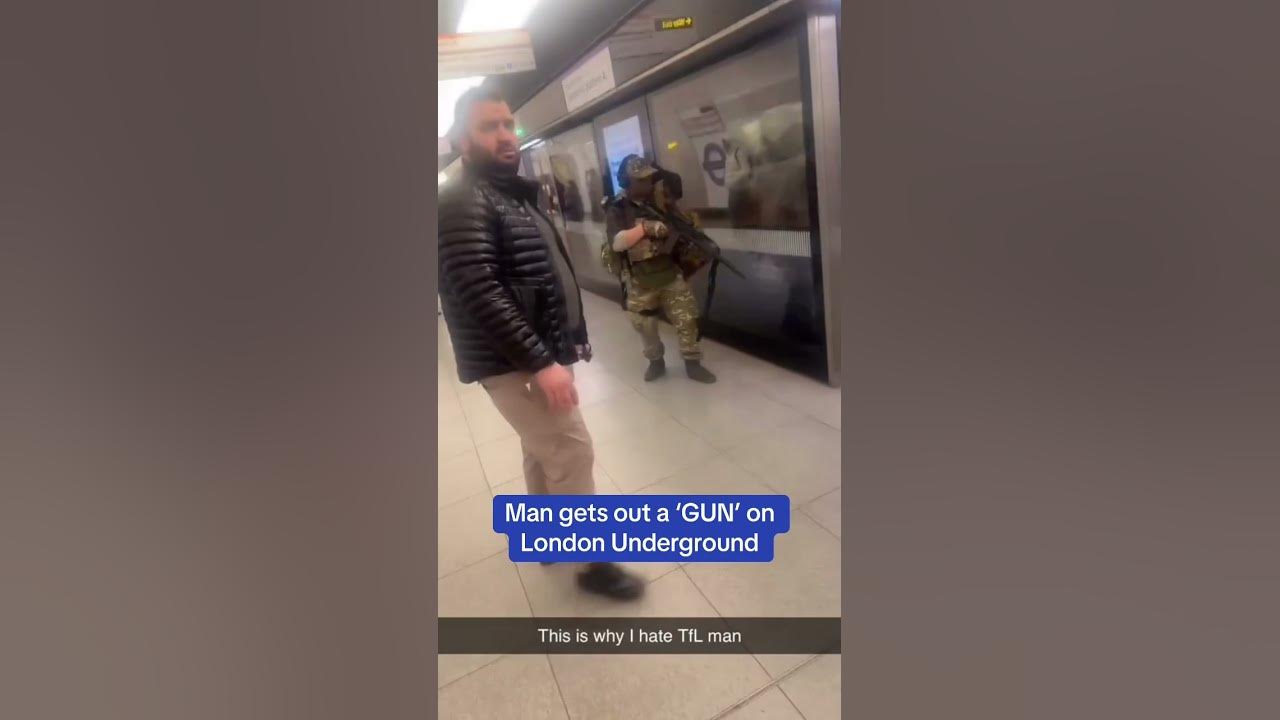 Shocking moment a man gets out a 'GUN' on London Underground