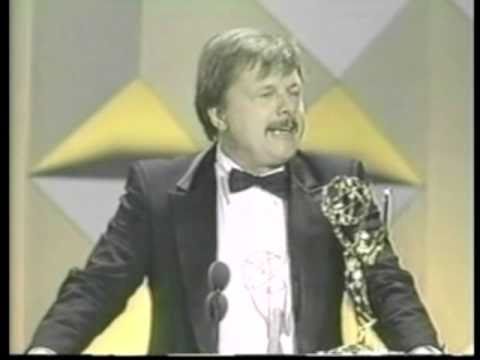 From the 1986 Emmy Awards, John Karlen wins for 'Outstanding Supporting Actor in a Drama Series' for his role as Harvey Lacey on Cagney & Lacey.
