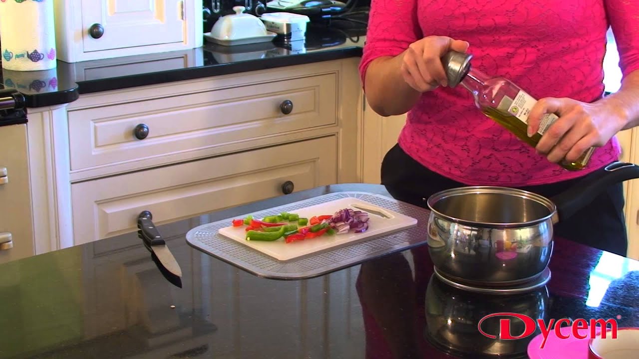 Chef uses Dycem Non-Slip Mat under chopping board - Dycem Non Slip