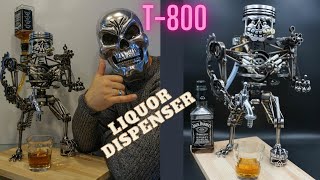 Liquor dispenser made from scrap metal and used autoparts. Piston art,piston skull, terminator