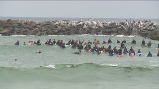 Hundreds gathered at Ocean Beach Dog Beach for paddle out to remember killed surfers