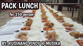COOKING FOR 250 PERSON PACK LUNCH.    (PORK MENUDO, FRIED CHICKEN, RICE AND COKE)
