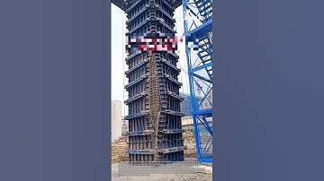 Pouring concrete column: people pouring concrete into a column form