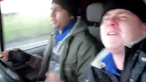 Two Blokes 'Singing' in a Van