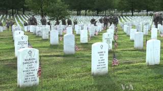 Soldiers Place US Flags in Arlington Cemetery for Memorial Day