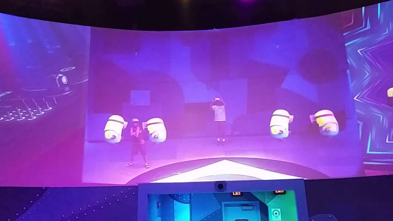 Kid dancing at Universal Studios with Minions.