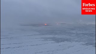 Aerial Footage Shows Lava Bubbling Amid A Snowstorm After Eruption In Iceland