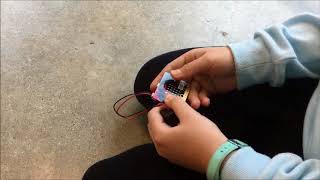 Grade 7 student using two micro:bits to make simple robot