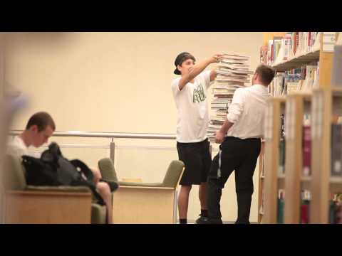 stacking-books-on-a-stranger-in-the-library