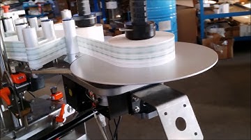 IC Filling Systems - Rotary Self-Adhesive Labeller with Optical Spotting