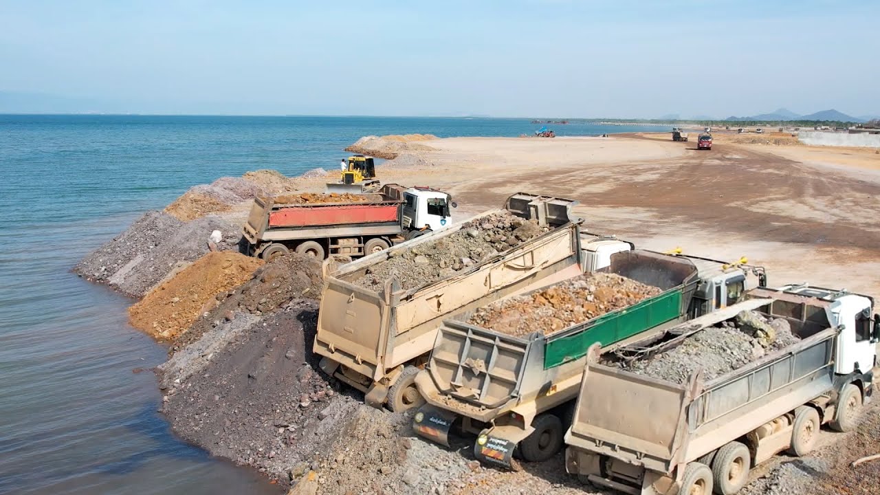 Beautiful Job! Dozer Komatsu D68p pushing rock in the sea with Dump ...