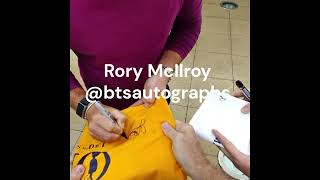 Rory McIlroy signing autographs for us before playing golf