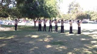 Navy Junior ROTC students perform a 21-gun salute in central Fresno on Memorial Day