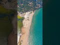 Vertical video. Dalyan, Turkey. Aerial shot of organized Iztuzu Beach with rows of sun loungers a...