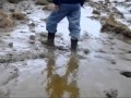 JCB rigger boots walking in mud