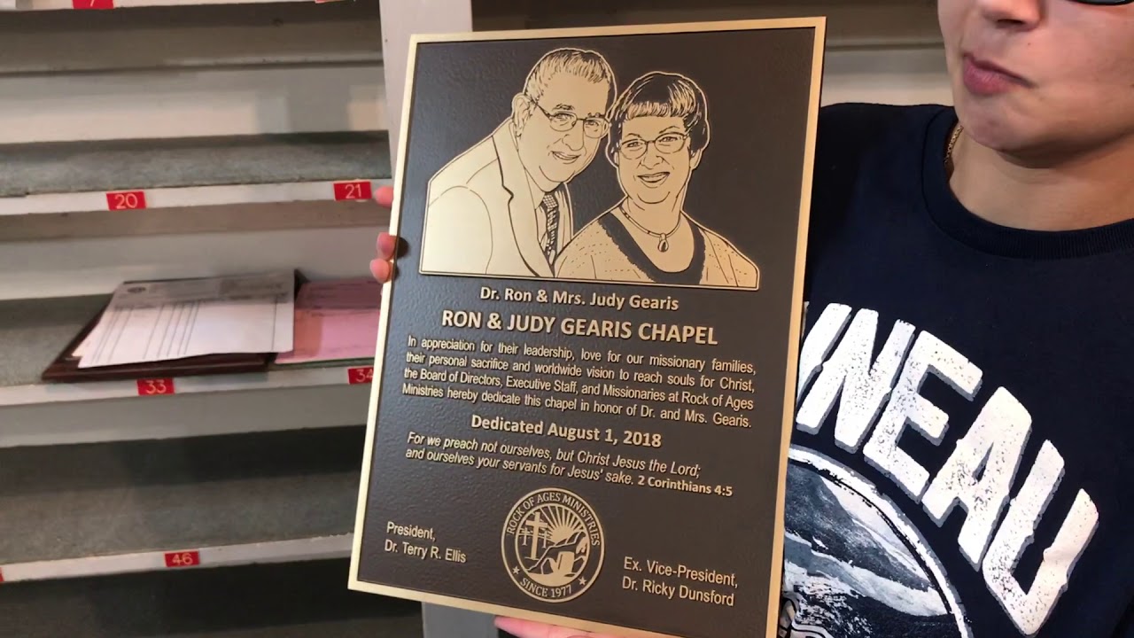 Review of a raised bronze casting plaque with flat relief photo.