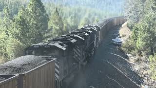 130-car coal train w/ double helpers crosses Greenhorn Trestle, Mullan Pass MT.