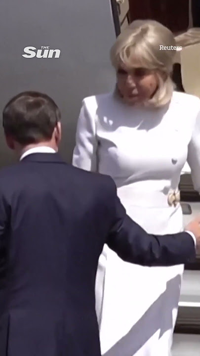 Moment Brigitte Macron 'rejects' husband's help leaving plane after viral slap vid