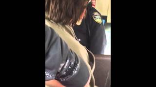 Cop yells at kid on bus for throwing ice ball