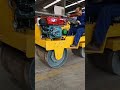 Technicians operate the road roller in person