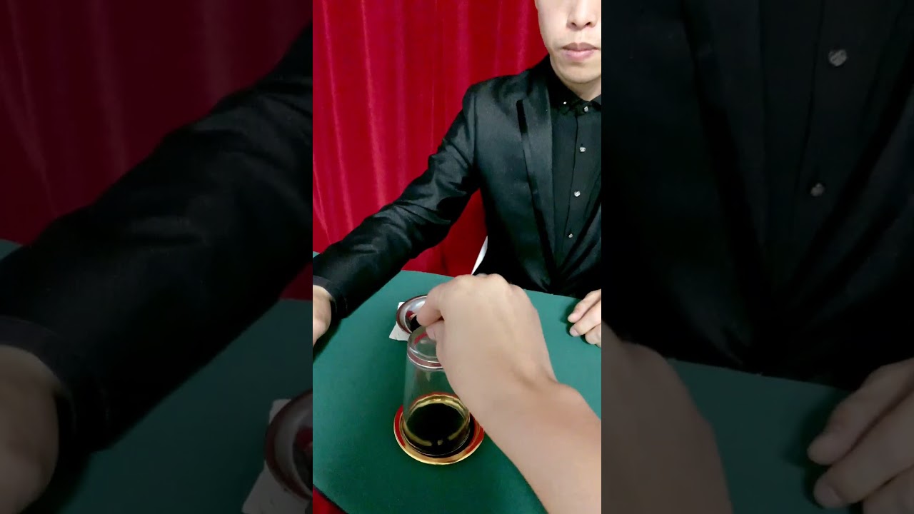 How can a coin go through the bottom of a cup?