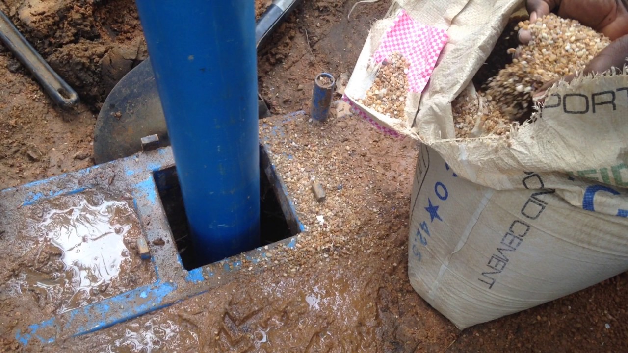 Vama Town Equipping the bore hole with pea gravel around the casing