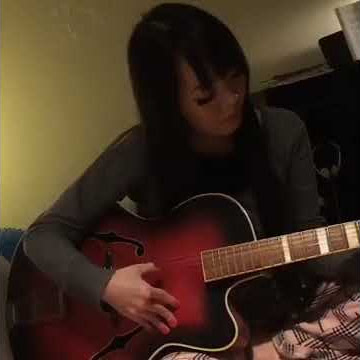 Hitomi Tanaka Playing Guitar