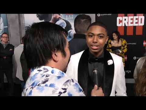 Thaddeus J.  Mixson Carpet Interview at Creed III Premiere