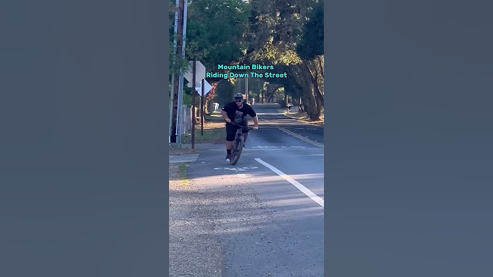 Normal People vs Mountain Bikers Riding Down The Street