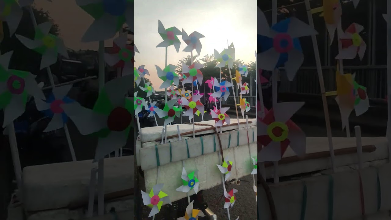 Windmill spins fast, shining bright in the night 🌪️✨ 