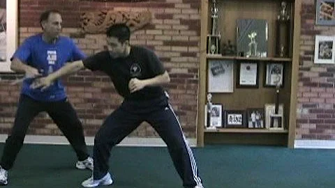 Guro Rick Tucci defends a straight thrust and foot sweeps.