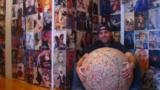 This Is What a 250 Pound Rubber Band Ball Created over 32 Years Looks Like
35-year-old Zack Hample has devoted 32 years of his life to creating a giant ball made of elastic rubber bands. Which means he started making the ball when he was just three or four years old. There’s something odd about a three-year-old trying to make a rubber band ball, at an age when most kids are just learning to play with a ball.
Perhaps this isn’t so surprising, considering all the odd things Zack has done in his life. Just last year, we had featured him here on OC for a completely different achievement. Zack is the world’s best bawl hawk. As of last year, he had collected over 5,800 balls at all the games he attended.
Now Zack is in the news again, for his giant rubber band creation. It cost him about $1,500 over the years to put bands together to make a large ball that weighs over 250 pounds. A video shows him rolling the ball around in his room, talking about how he created This Is What a 250 Pound Rubber Band Ball Created over 32 Years Looks Like